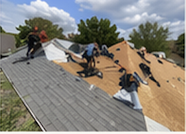 Crew working across a residential roof